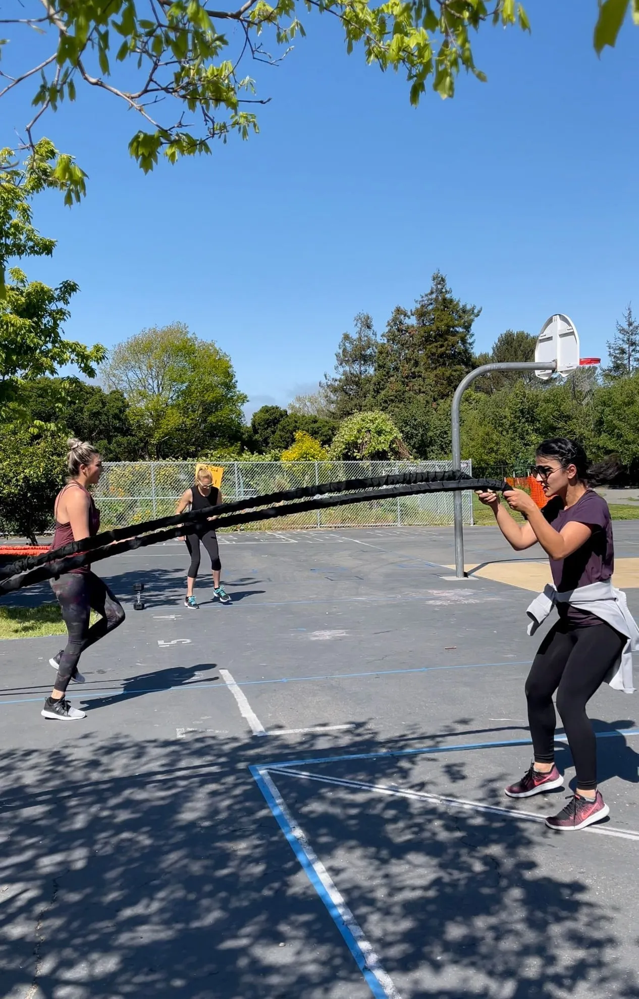 Battle-rope training at an outdoor group session